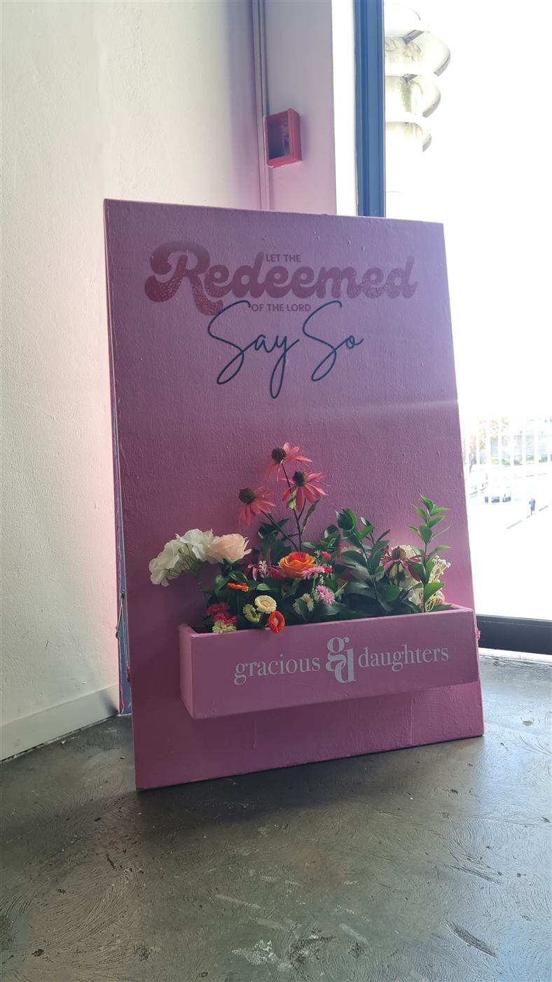 Gracious Daughters Women's Conference floral event sign