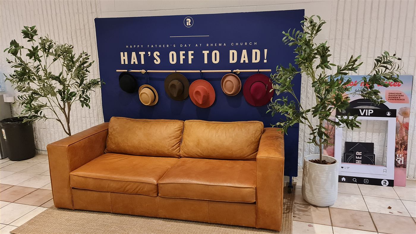 Hat's Off To Dad Father's Day event backdrop with hat display