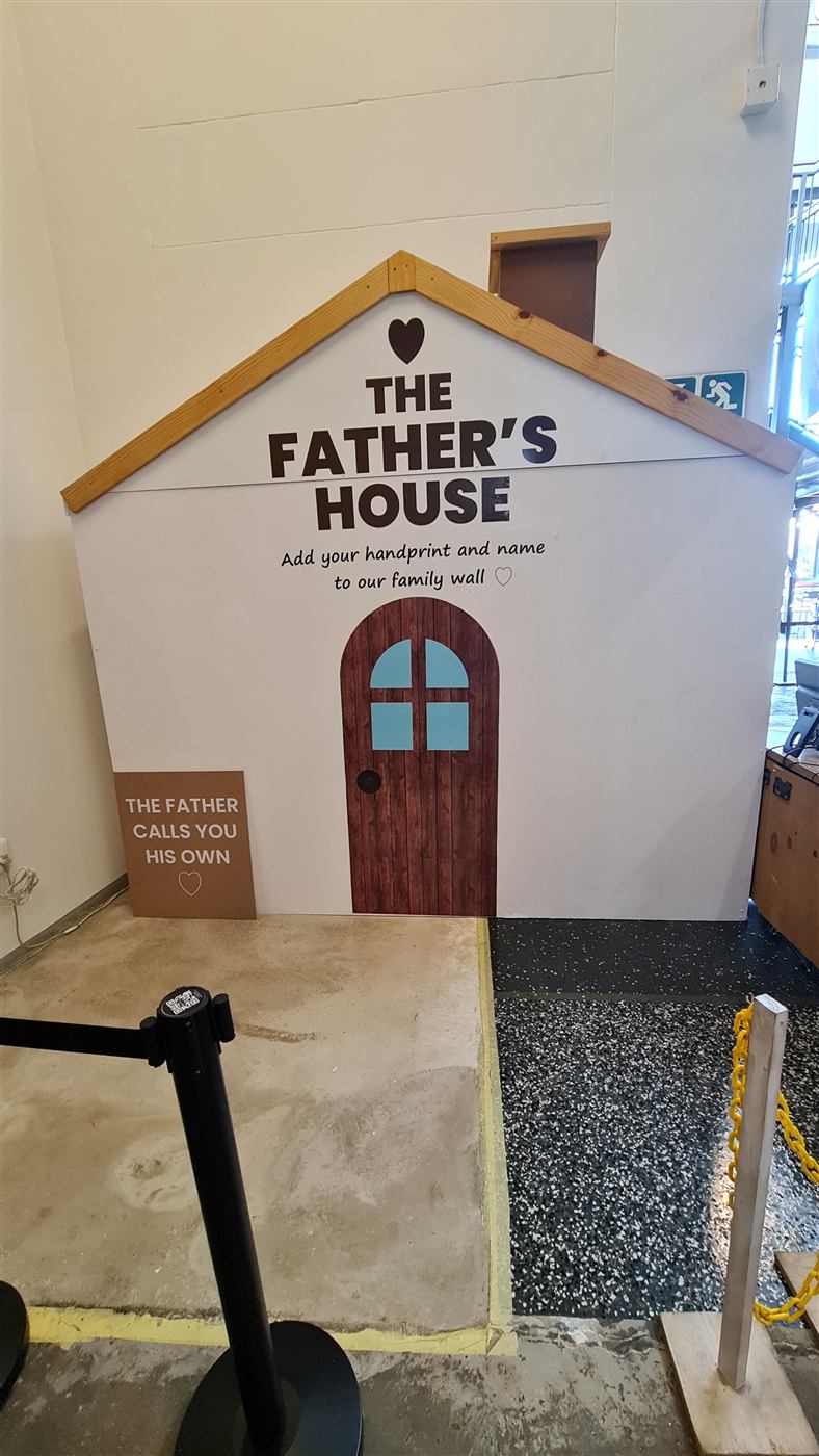 The Father's House event backdrop shaped like a house