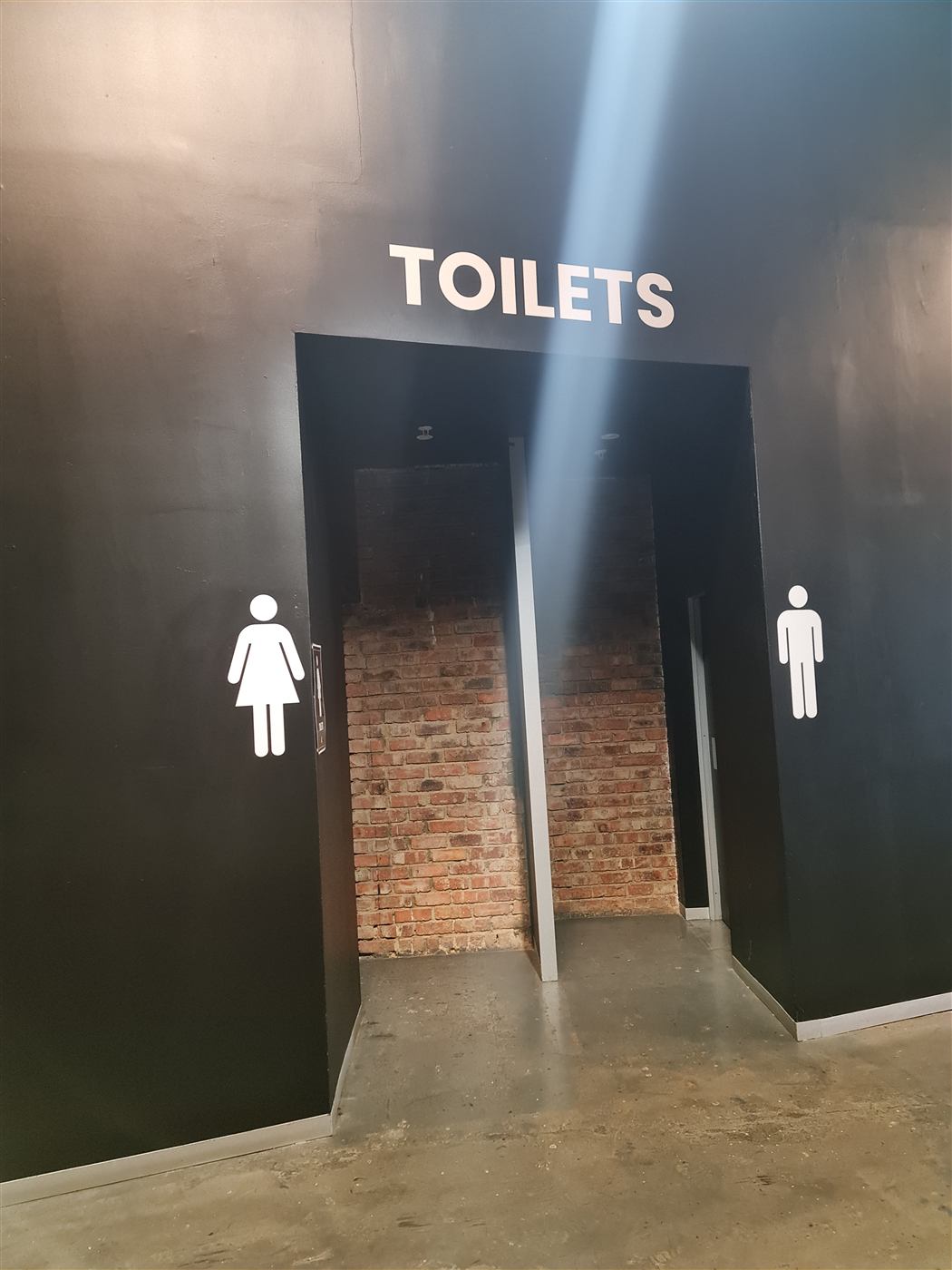 Toilets wayfinding signage with pictograms